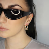Trapped ball hoop earrings. Hinge hoop with imitation diamond ball. 14k gold plate over recycled brass.