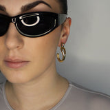 Drop earrings with link stud and curl drop. 14k gold plate over recycled zinc.