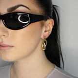Drop earrings with link stud and curl drop. 14k gold plate over recycled zinc.