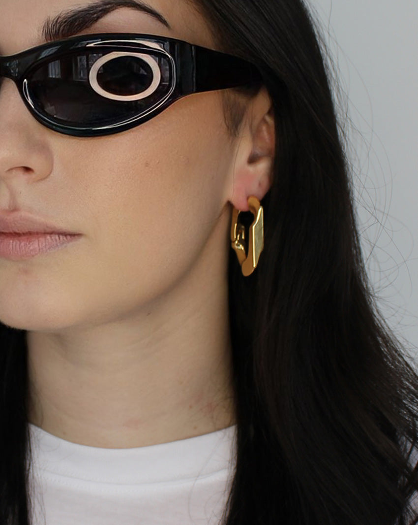 Large chain link hoop earrings. Hinge hoop design. 14k gold plate over recycled zinc.