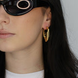 Large chain link hoop earrings. Hinge hoop design. 14k gold plate over recycled zinc.