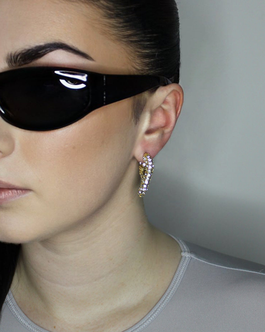 liquid twist hoop earrings with imitation diamonds. 14k gold plate over recycled brass.