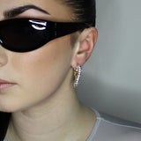 liquid twist hoop earrings with imitation diamonds. 14k gold plate over recycled brass.