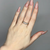 Liquid ring design with imitation diamonds. 14k gold plate over recycled brass.