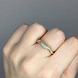 Liquid ring design with imitation diamonds. 14k gold plate over recycled brass.