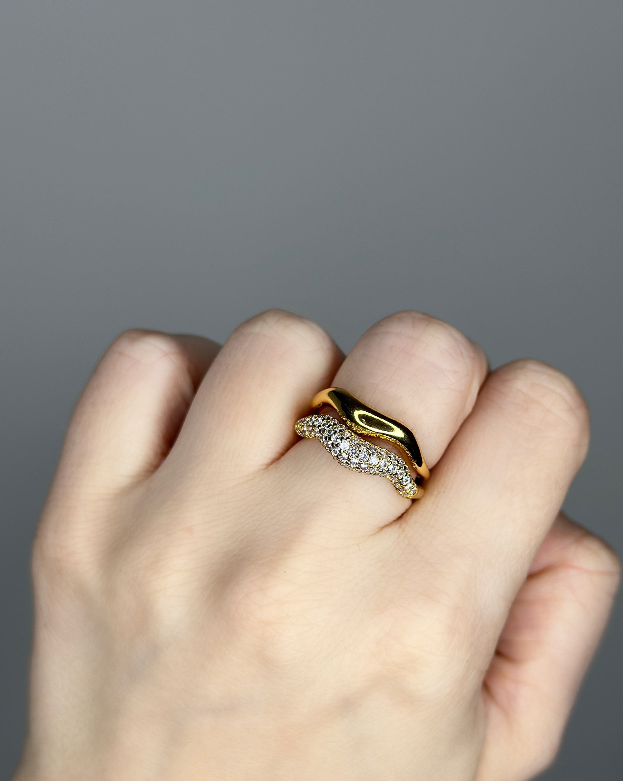 Liquid metal ring design. 14k gold plate over recycled zinc.