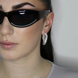 liquid twist hoop earrings with imitation diamonds. Sterling silver plate over recycled brass.