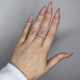 Liquid ring design with imitation diamonds. Sterling silver plate over recycled brass.