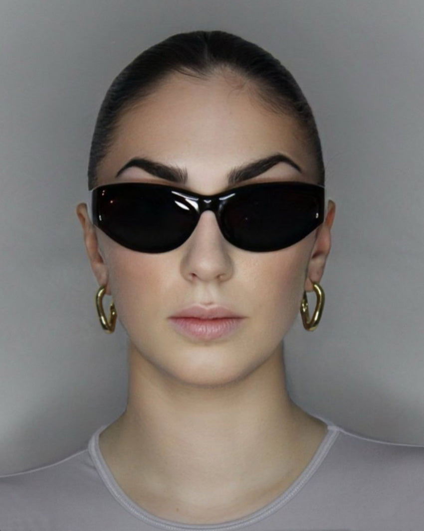 Hoop earrings in liquid twist design. 14k gold plate over recycled zinc.