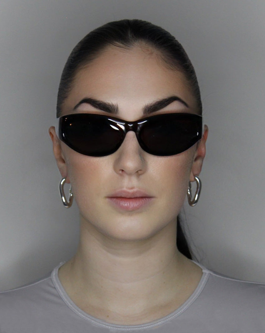 Hoop earrings in liquid twist design. Sterling silver plate over recycled zinc.