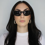 Hoop earrings in large oval shape. Sterling silver plate over recycled zinc.