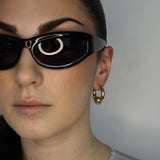 Trapped ball hoop earrings. Hinge hoop. 14k gold plate over recycled zinc.