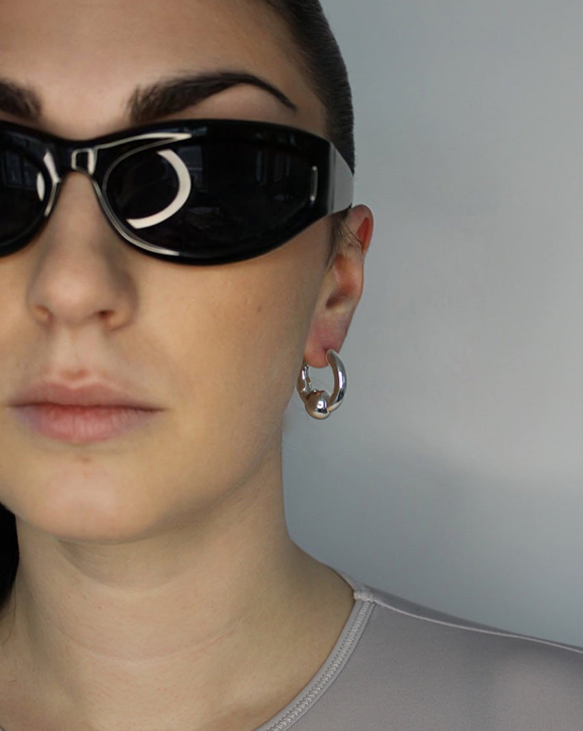 Trapped ball hoop earrings. Hinge hoop. Sterling silver plate over recycled zinc.