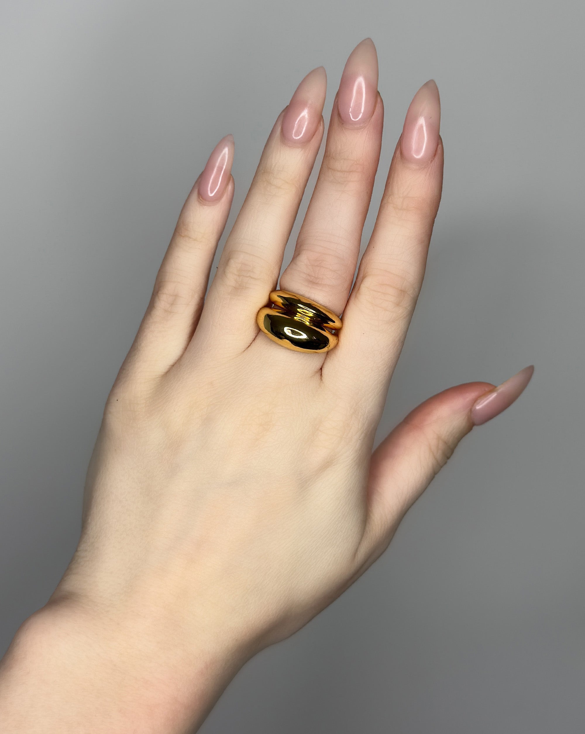 Stackable ring set featuring 2 dome ring designs  1 bubble dome ring design and 1 small ridged dome ring design. 14k gold plate over recycled zinc.