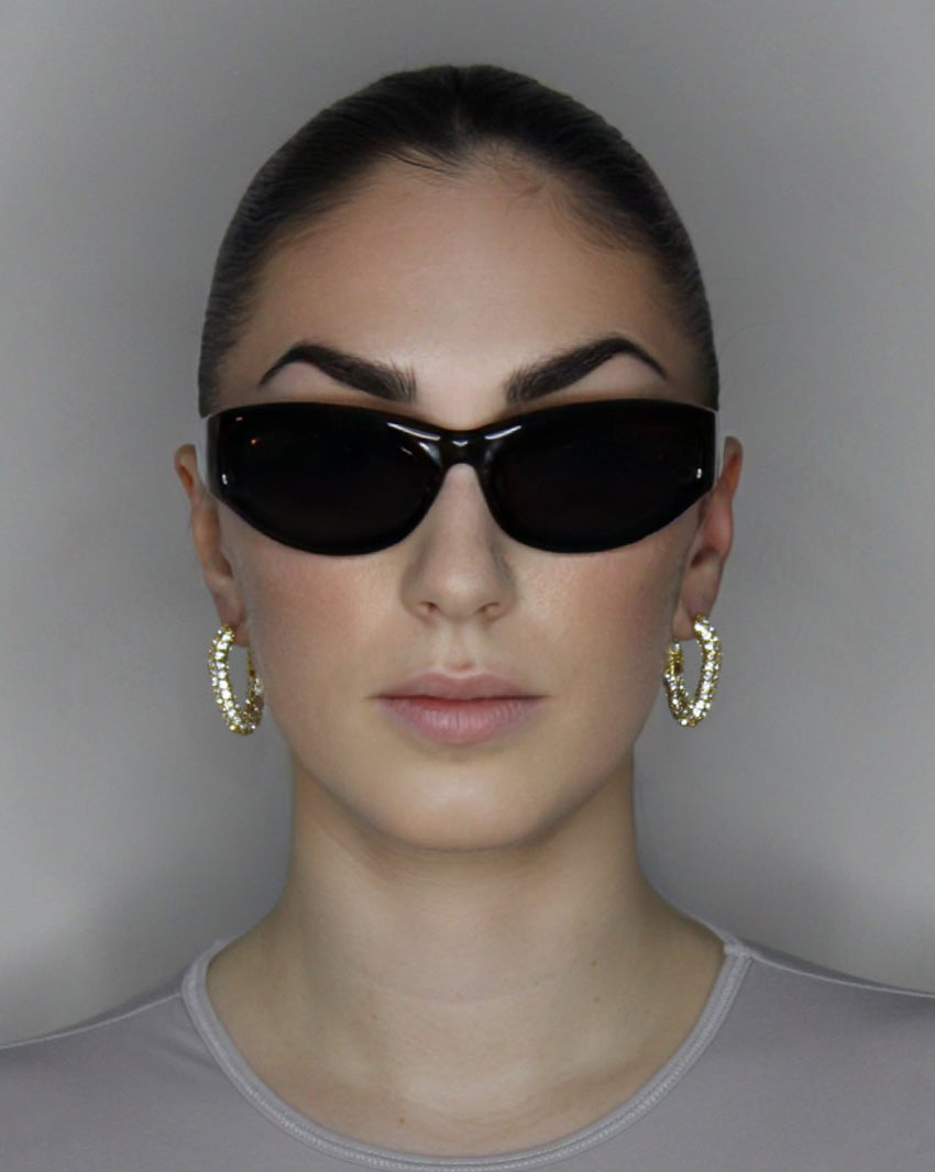 liquid twist hoop earrings with imitation diamonds. 14k gold plate over recycled brass.