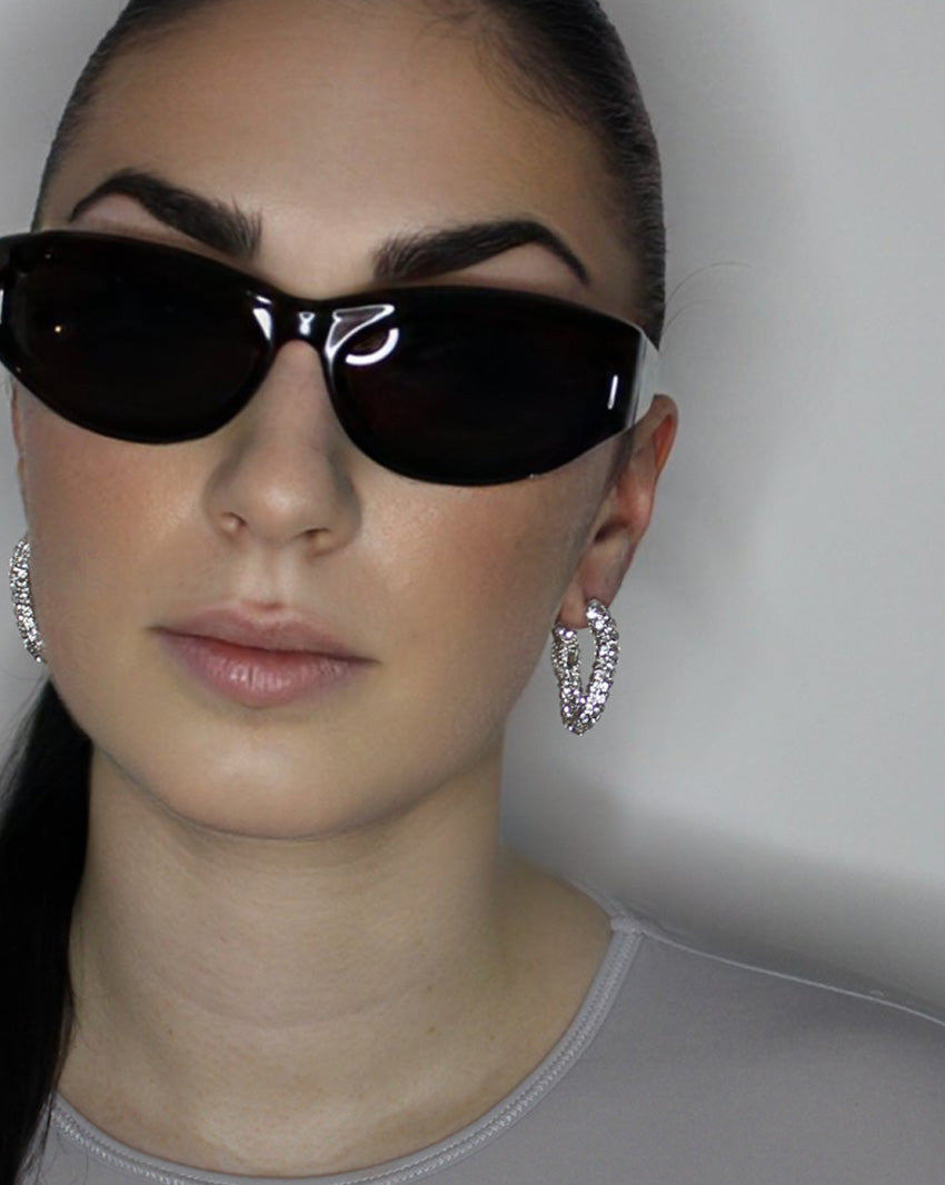 liquid twist hoop earrings with imitation diamonds. Sterling silver plate over recycled brass.