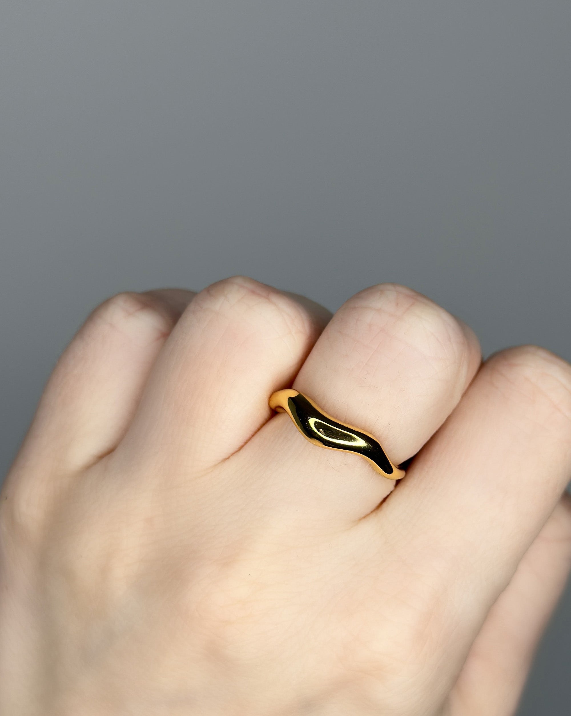 Liquid metal ring design. 14k gold plate over recycled zinc.