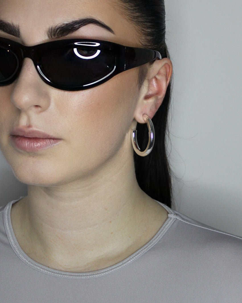 Perfect everyday hoop earrings. Solid tube hoop design, 40mm diameter. Sterling silver plate over recycled zinc.