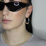 Perfect everyday hoop earrings. Solid tube hoop design, 40mm diameter. Sterling silver plate over recycled zinc.